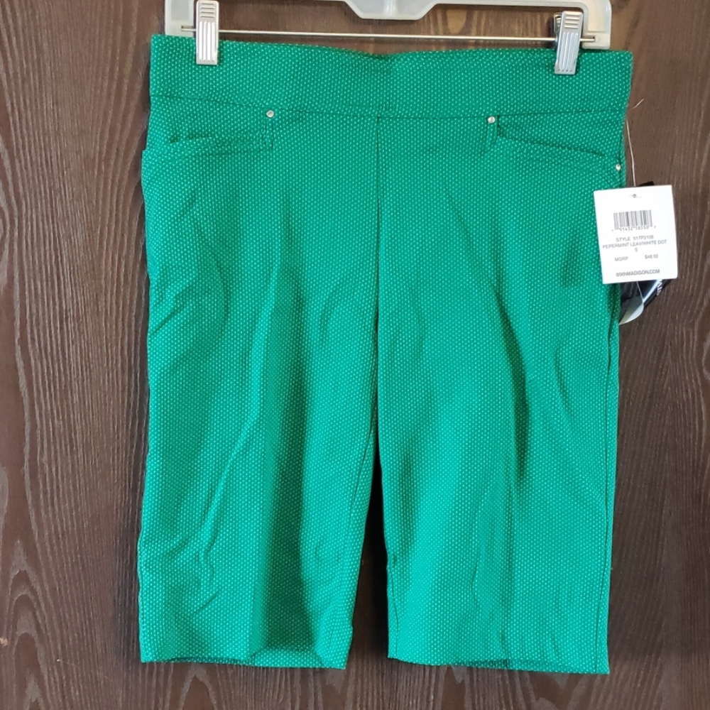 Green and white golf shorts